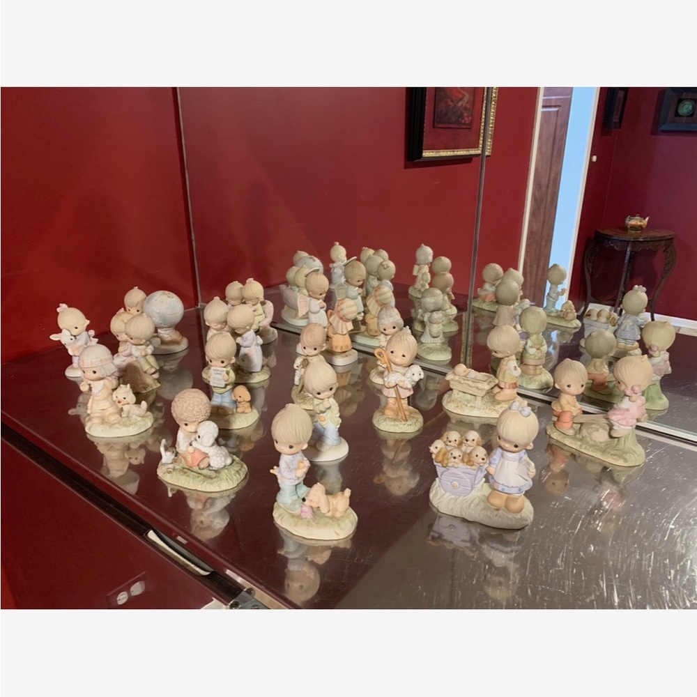 Complete set of the 21 retired Precious Moment statues